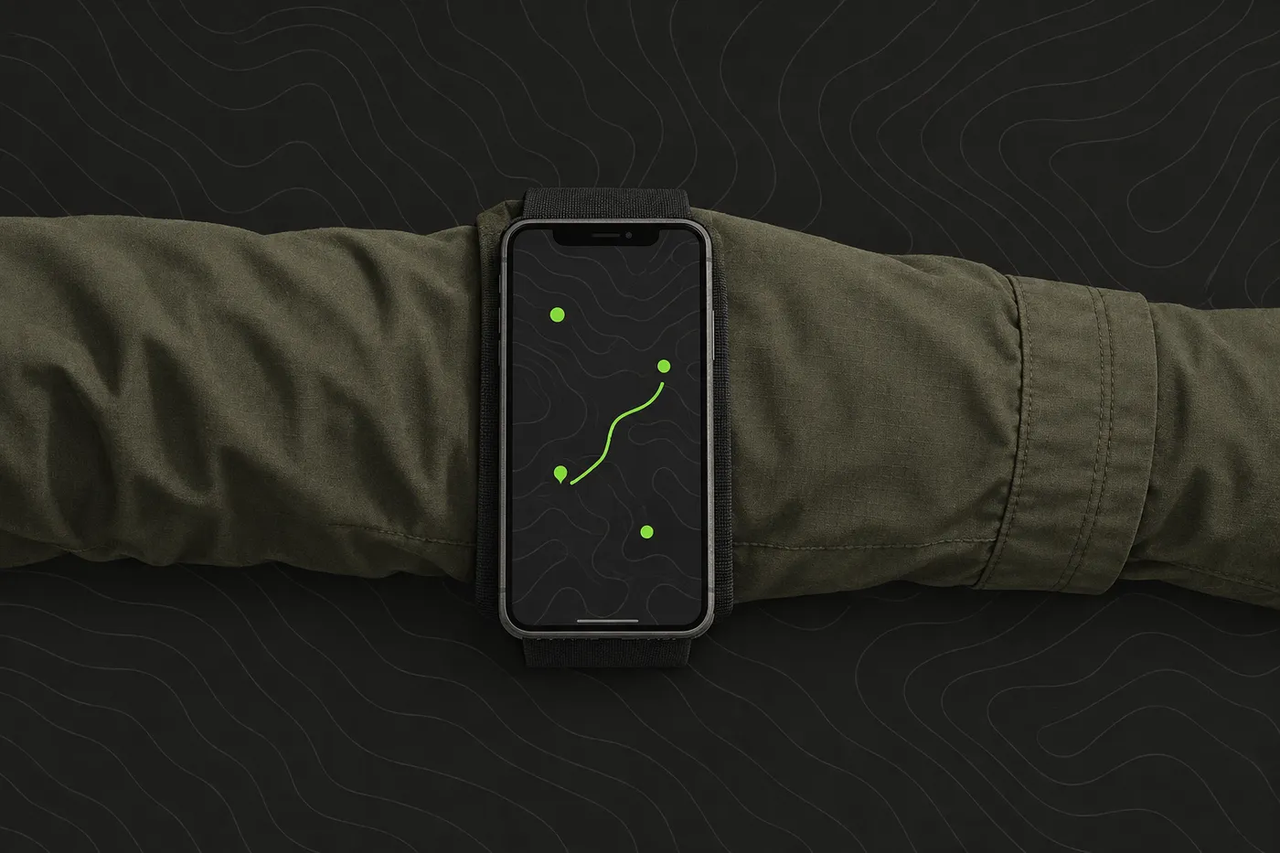 A phone strapped to a forearm with a wide armband, showing an abstract map with green position dots