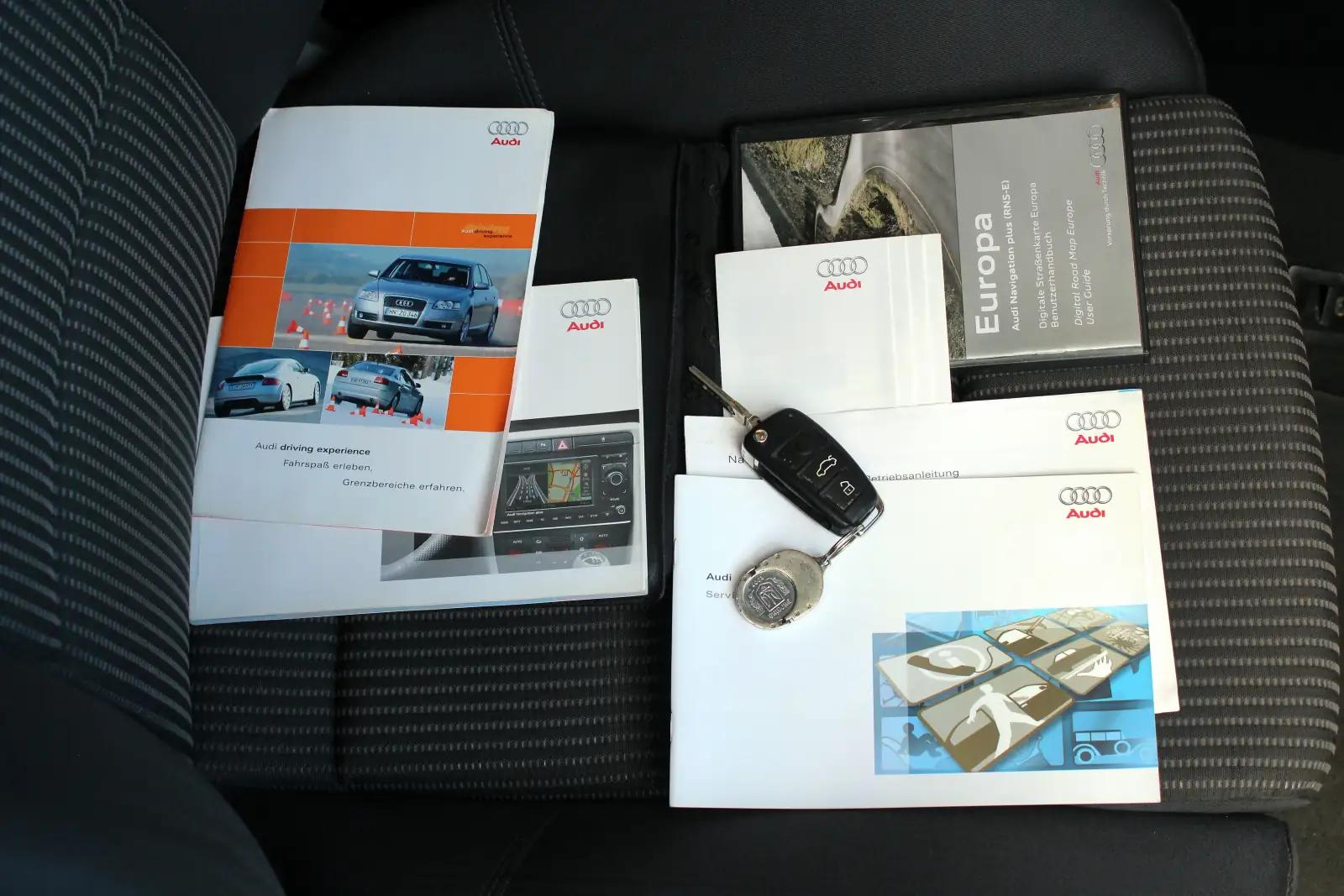 Service history documents affecting car resale value - mechanic reviewing vehicle maintenance records