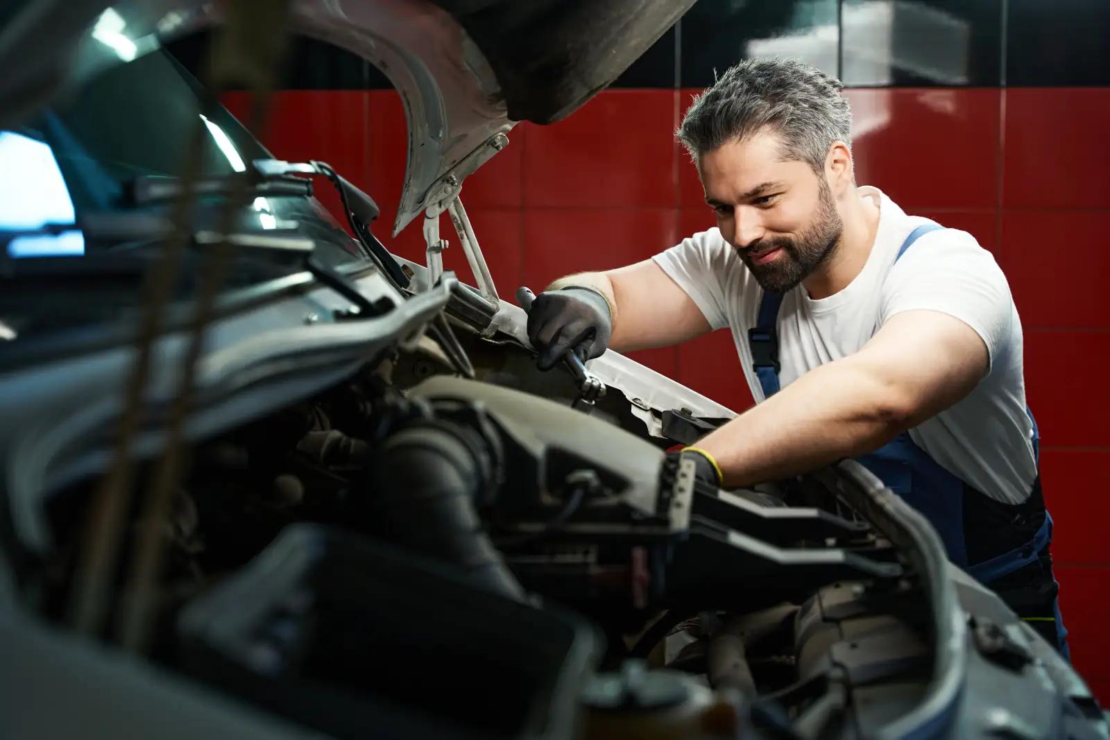 Professional AutoChain garage employee working with customers, showcasing excellent customer service and modern workshop environment