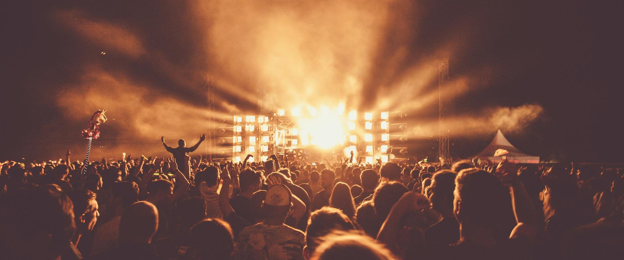 Crowd under stage lights at a Red Bull event
