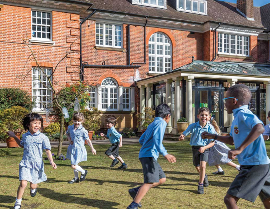 Children playing outside Grimsdell school 
