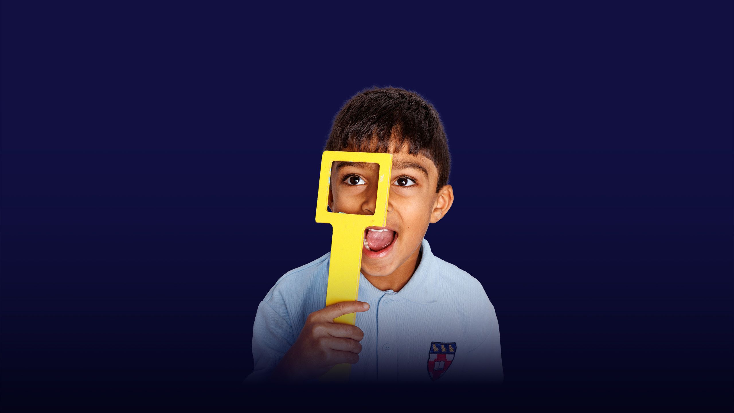 Image of a little boy looking through an object with an overlay of the text "inspiring minds" 