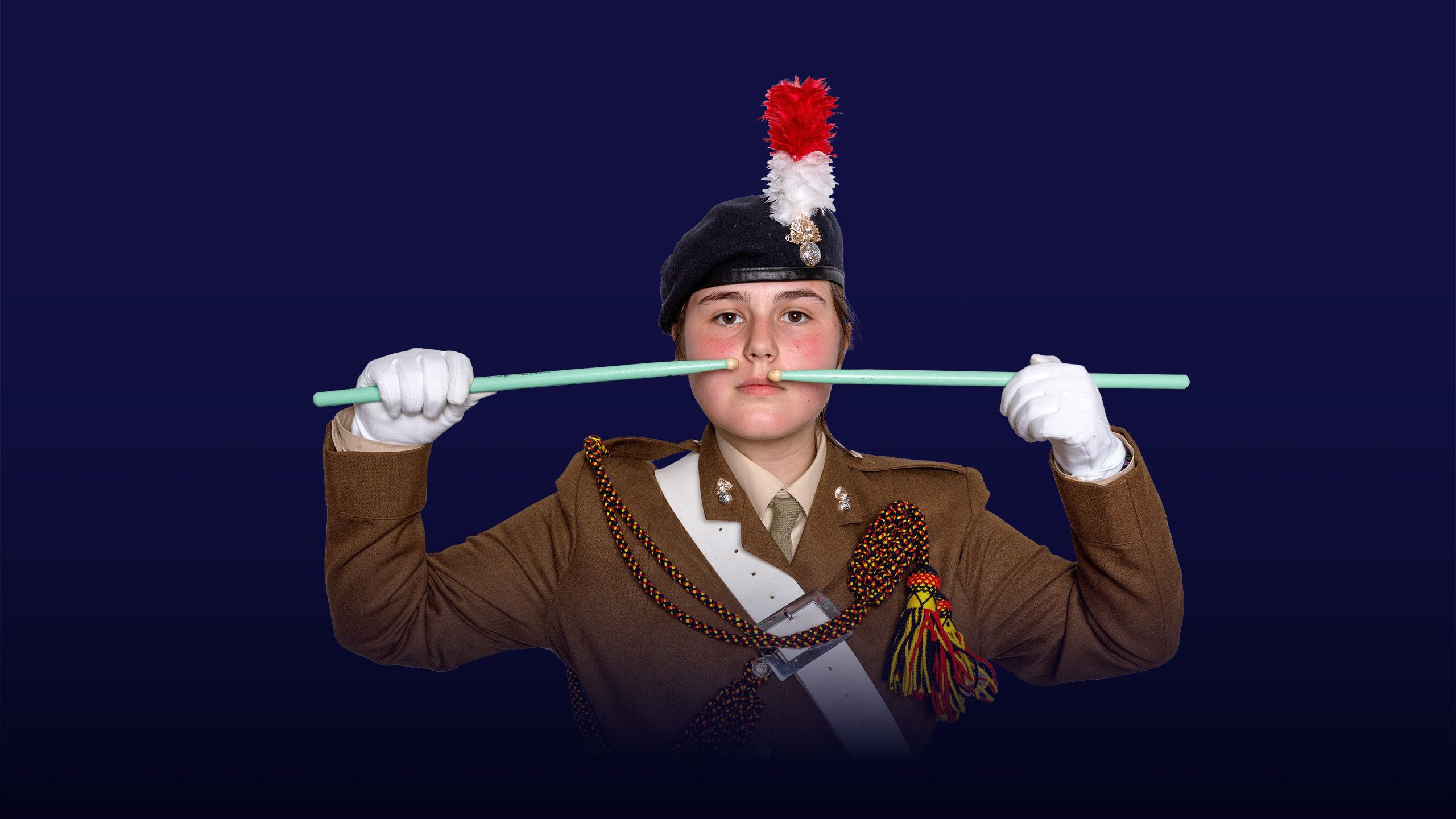 Image of a girl wearing military-like uniform with an overlay of the text "instilling values"