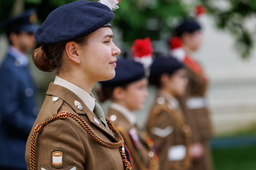 Young students outdoors in uniform similar to military uniform