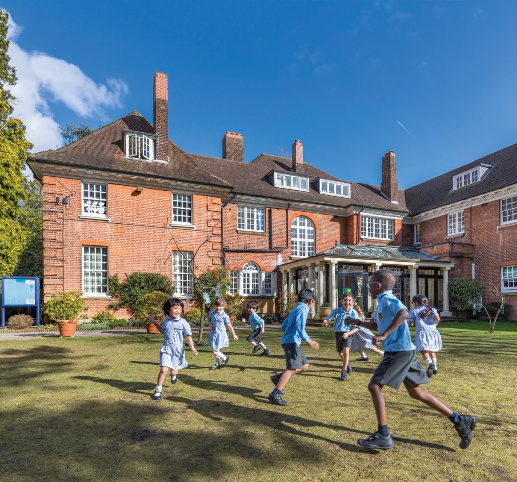 Children playing outside Grimsdell school 