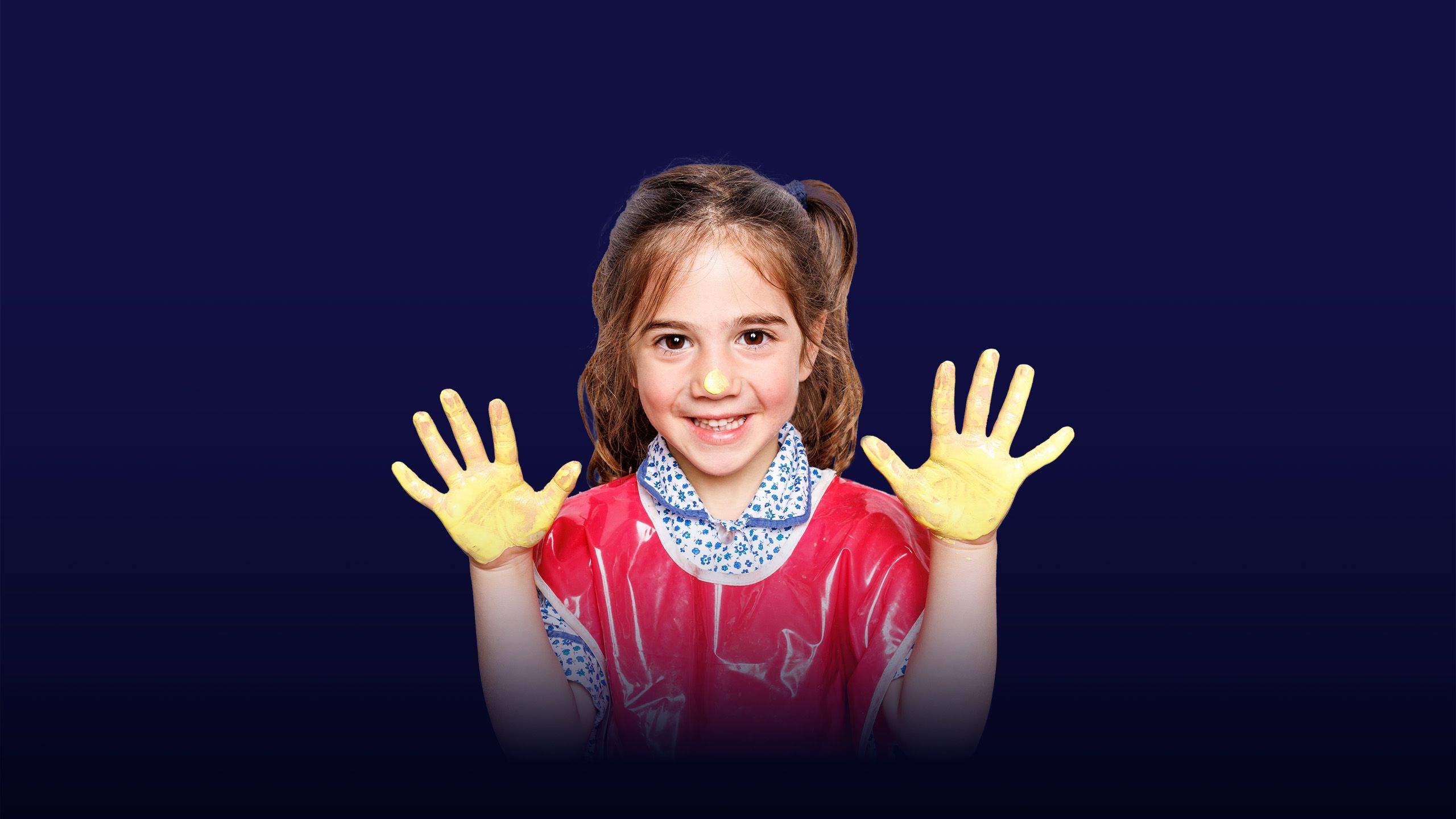Image of a little girl showing yellow paint on her hands with a overlay of the text "instilling values"