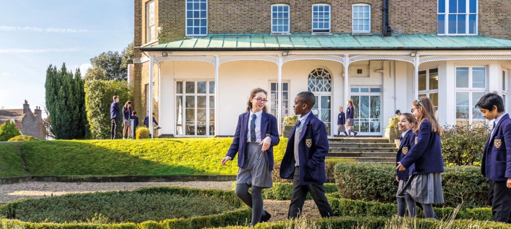 Children from Belmont Mill Hill Prep walking on school grounds 