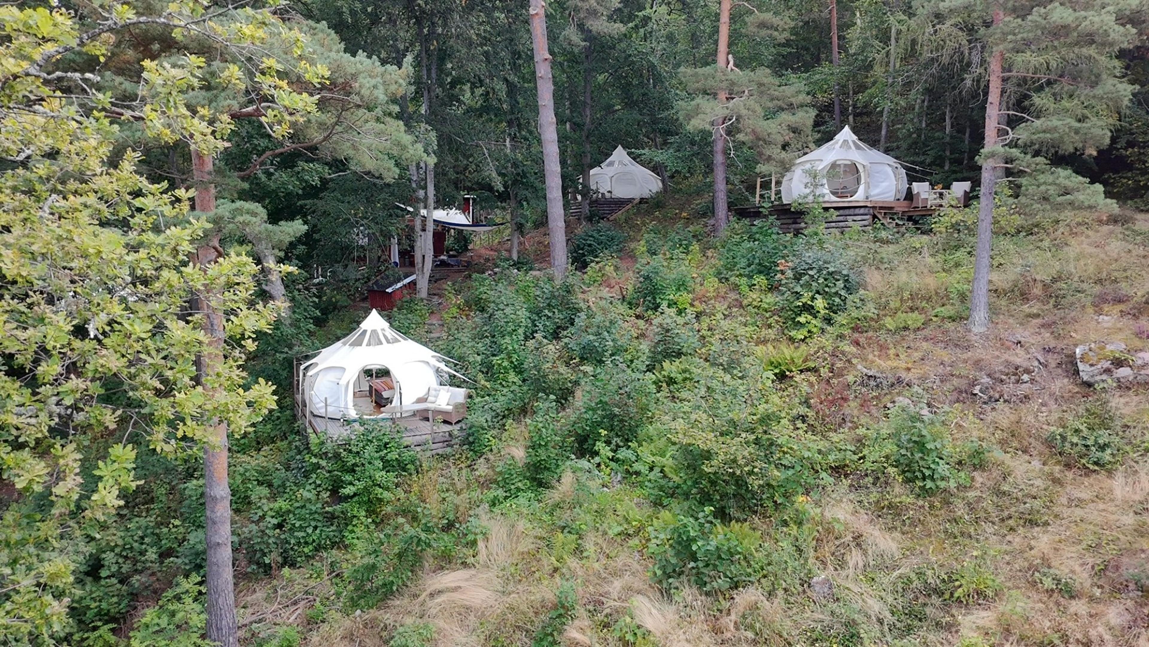 All three Gränna Glamping tents in the forest