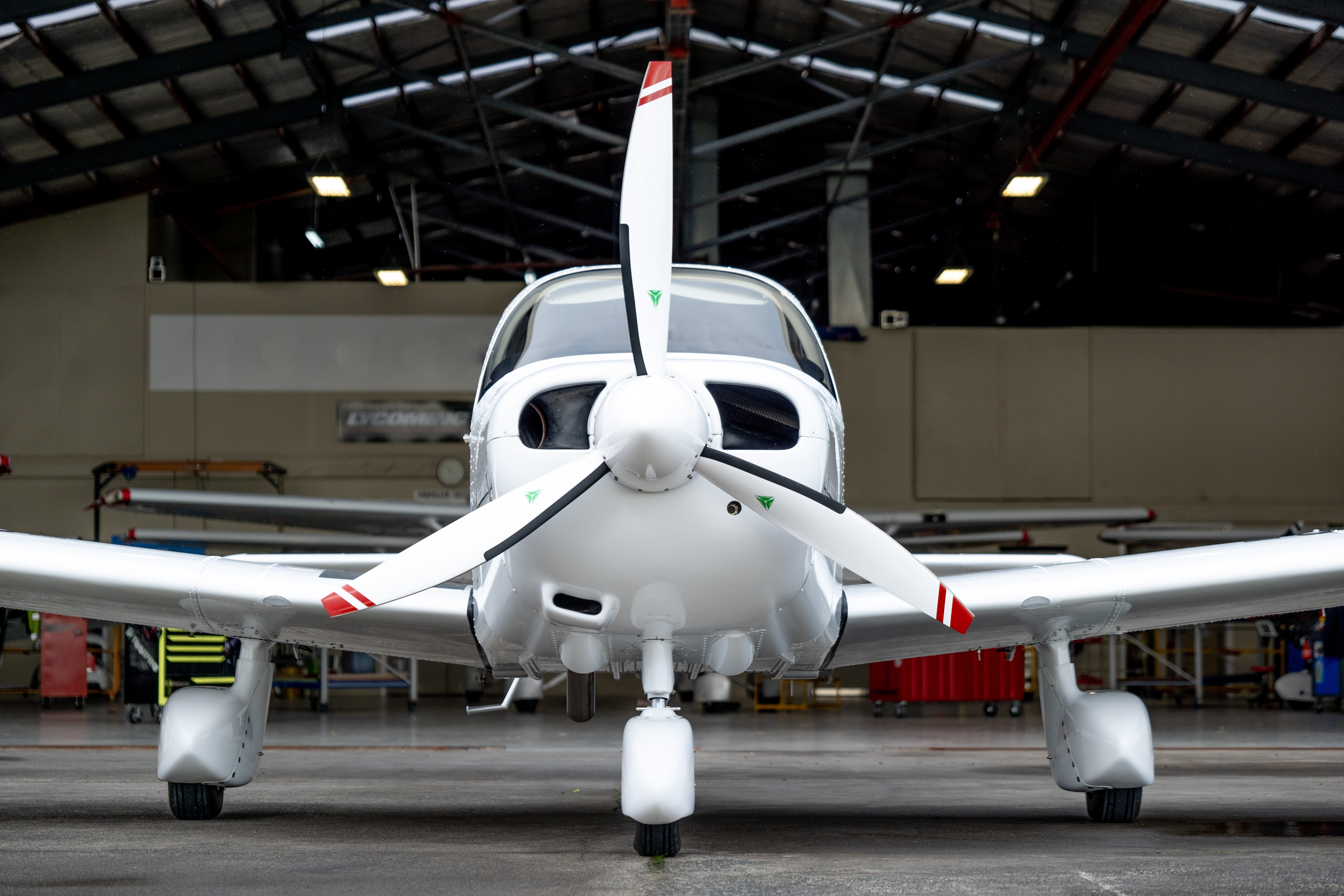 Fixed wing aircraft in hangar front on