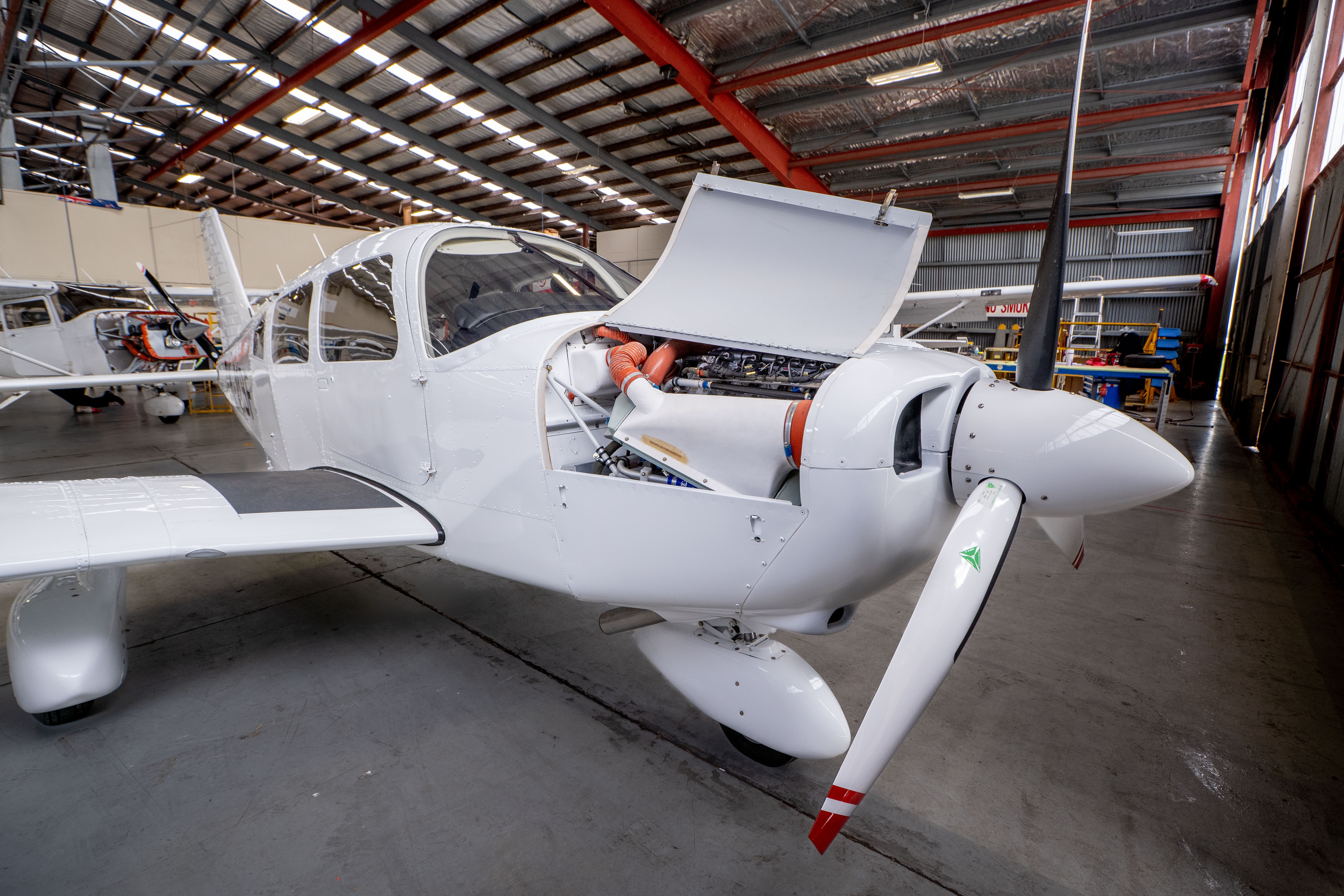 fixed wing aircraft in hangar for maintenance work