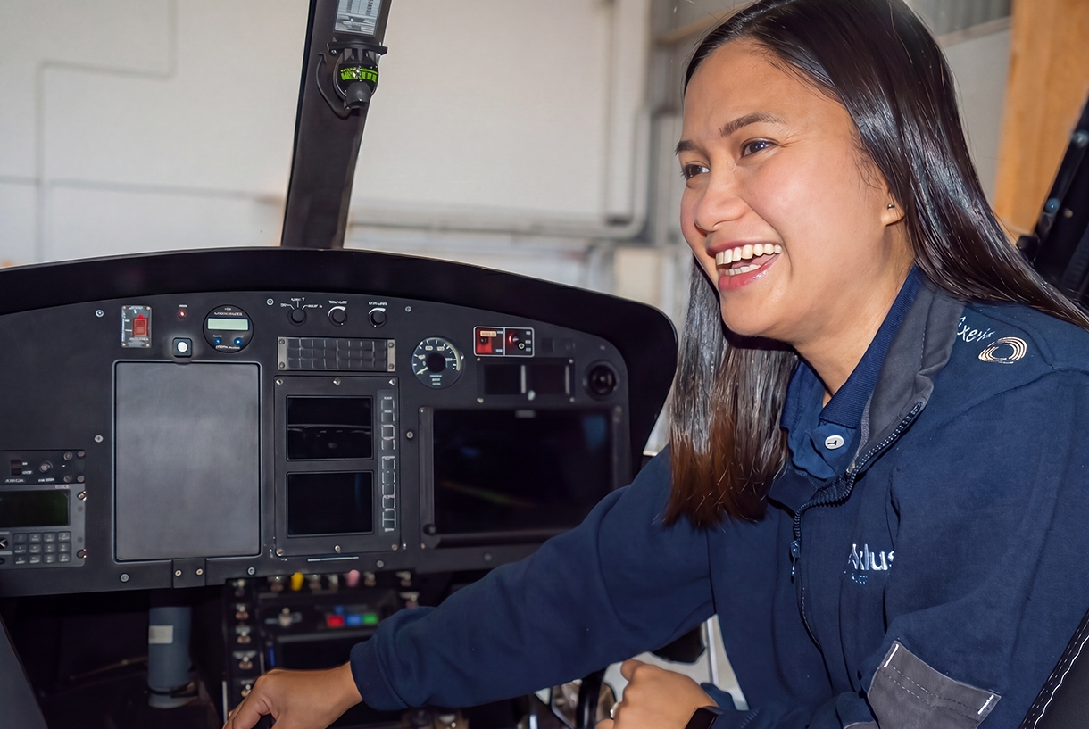 Freda in a helicopter in the hangar working on Avionics