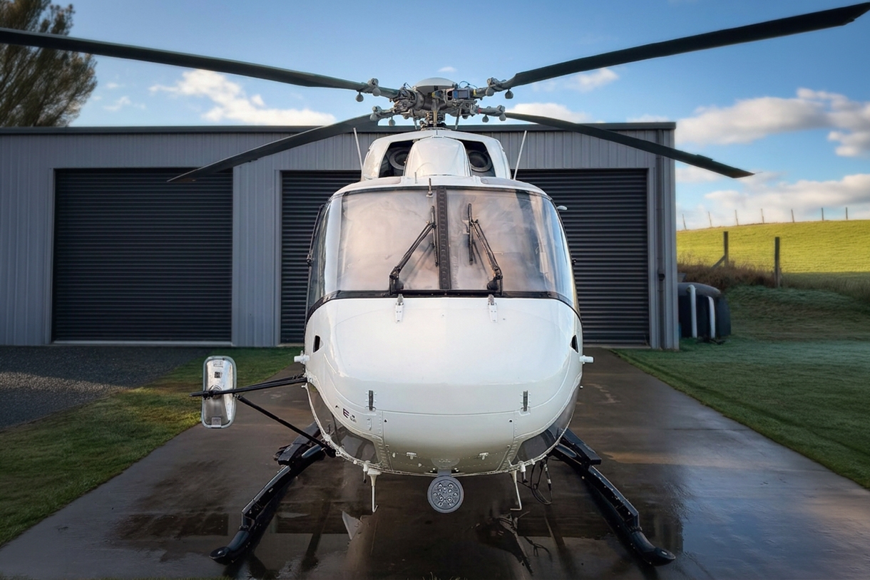 1996 Kawasaki BK117-C1 front on in front of hangar