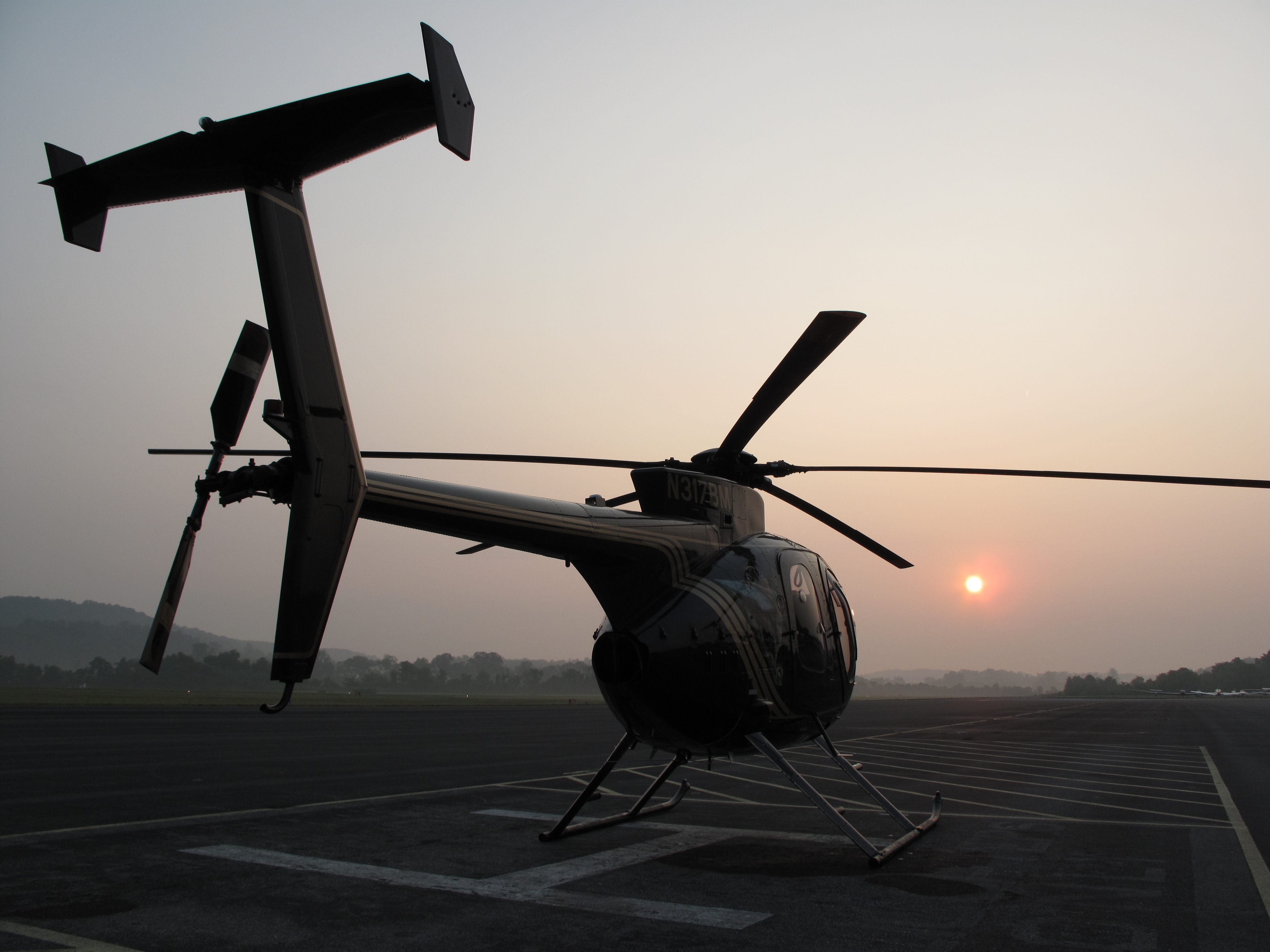 MD helicopter at sunrise