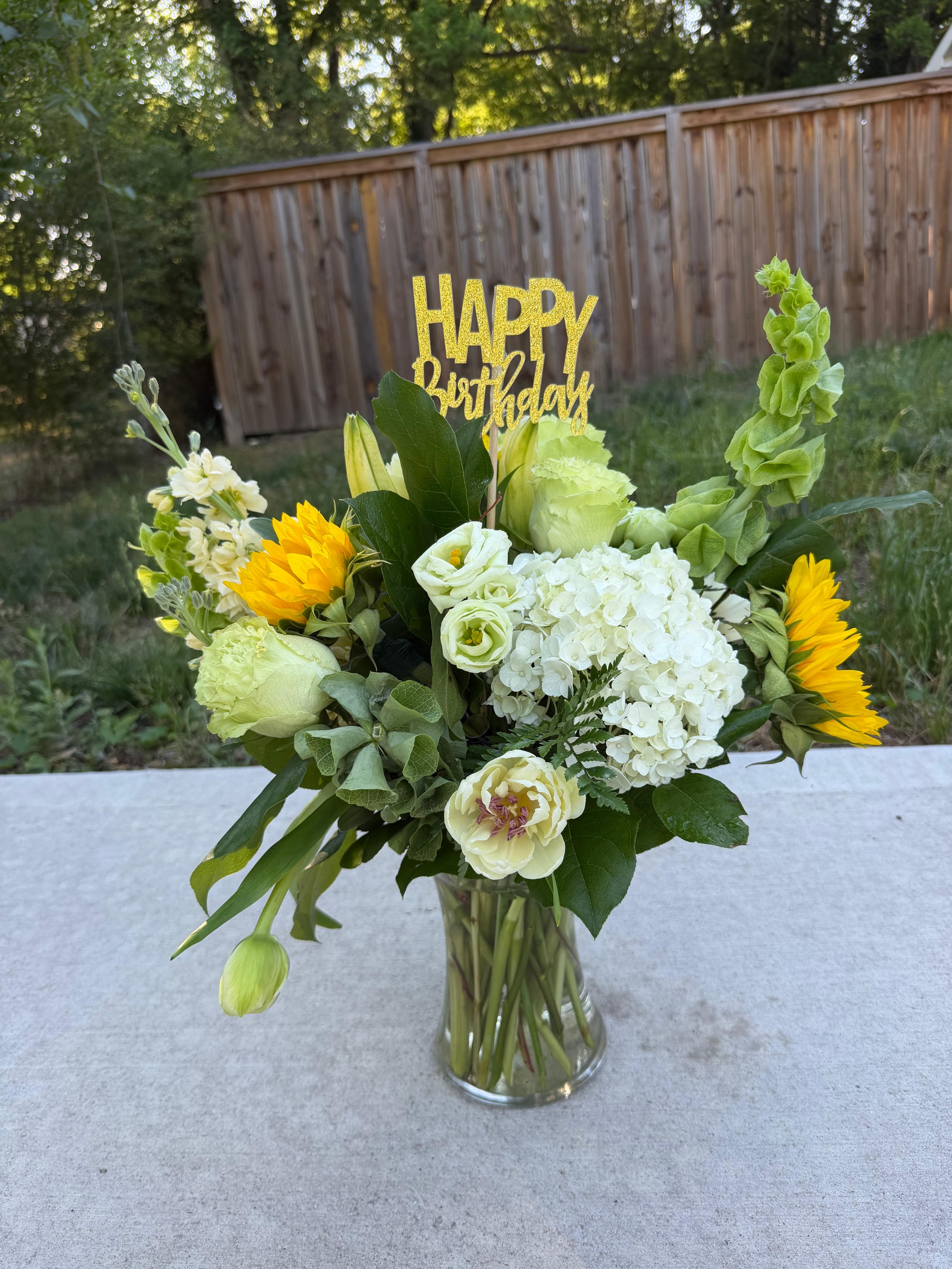 Sunflowers, tulips, and roses