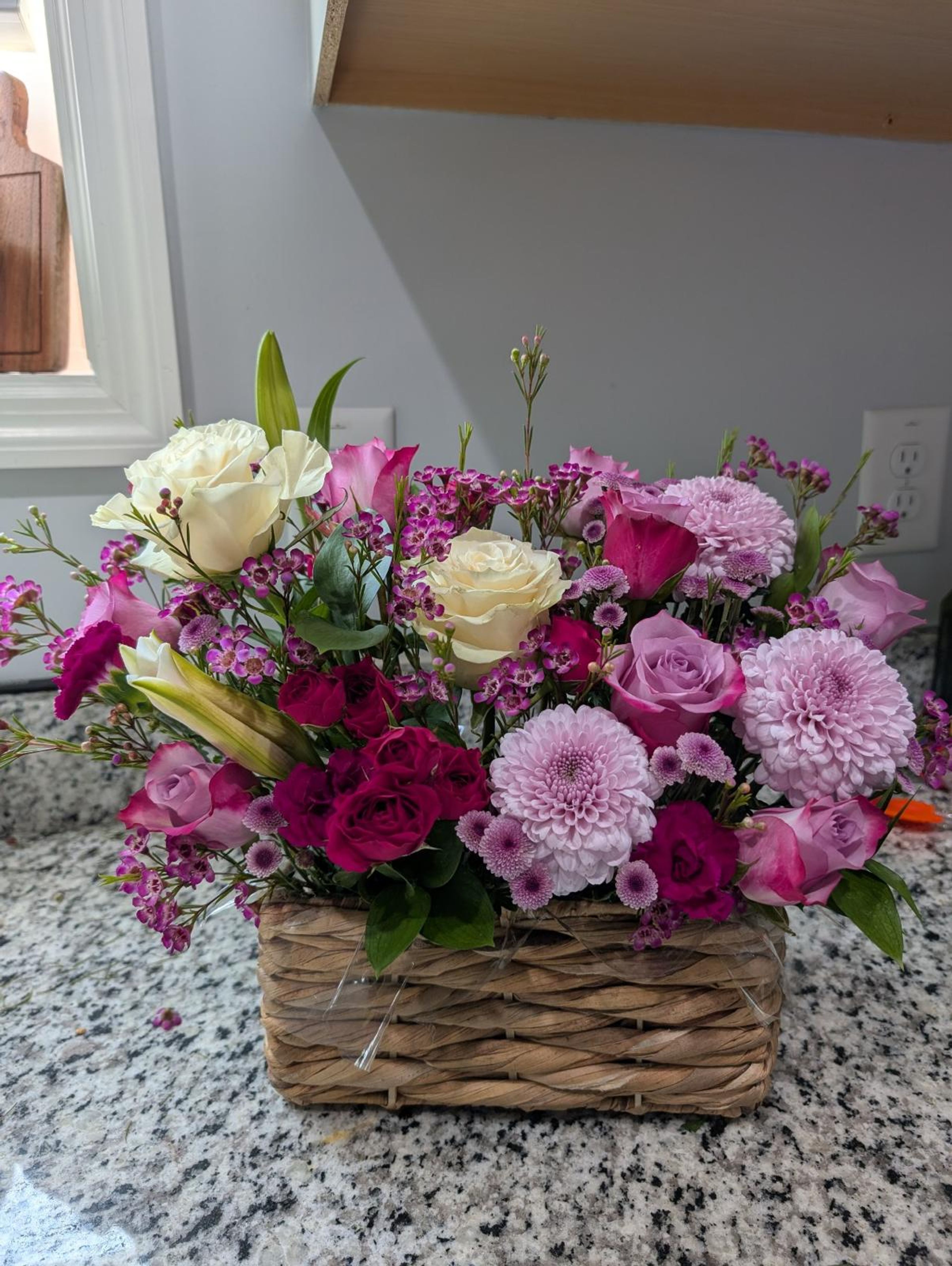Dark and light purple floral wicker basket