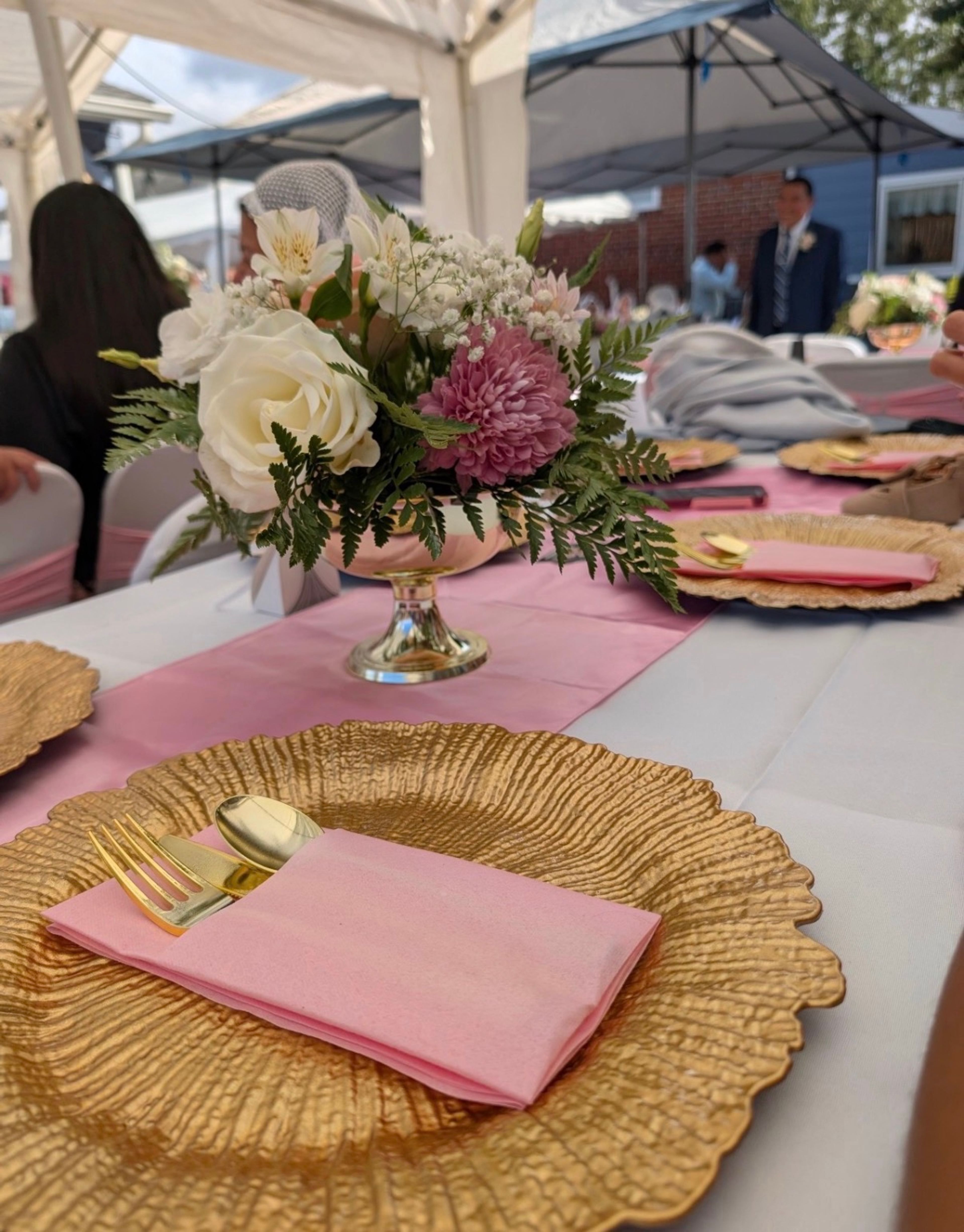 White and pink florals in a gold compote -wedding centerpiece