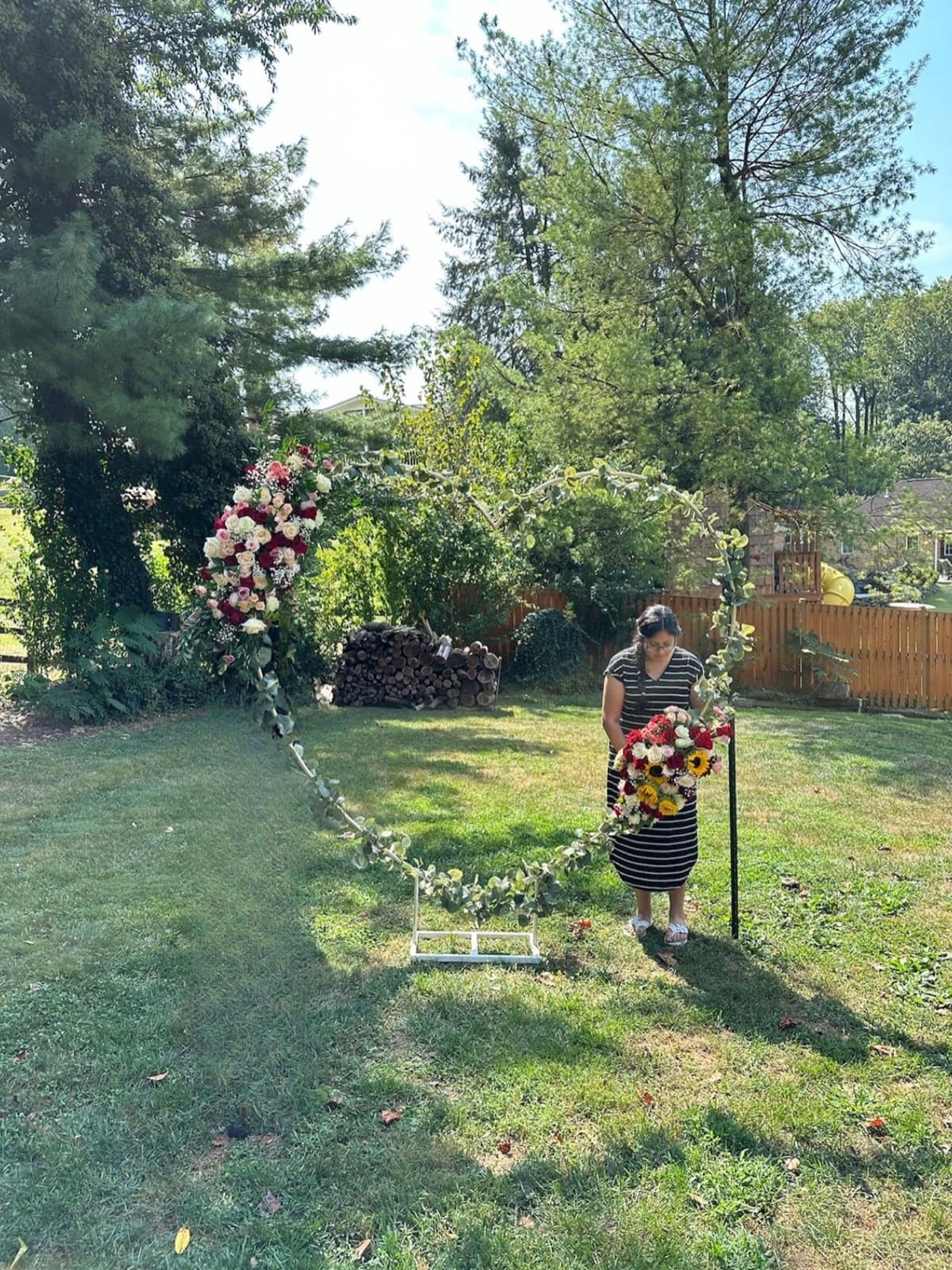 Heart-shaped sympathy arrangement filled with fresh flowers