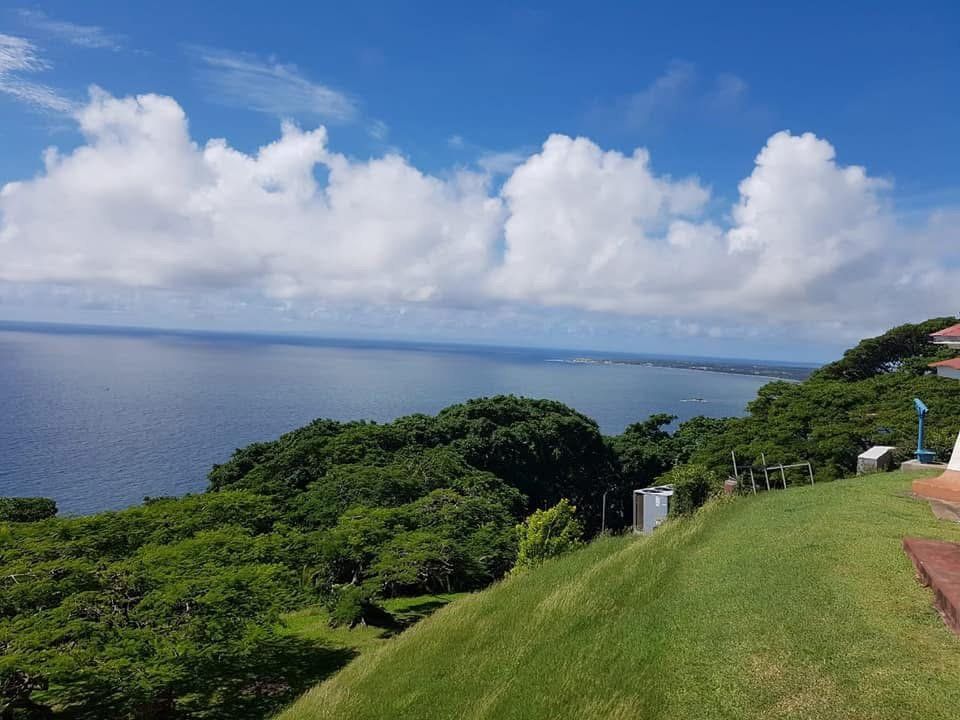 The view out over the sea from a grassy hilltop
