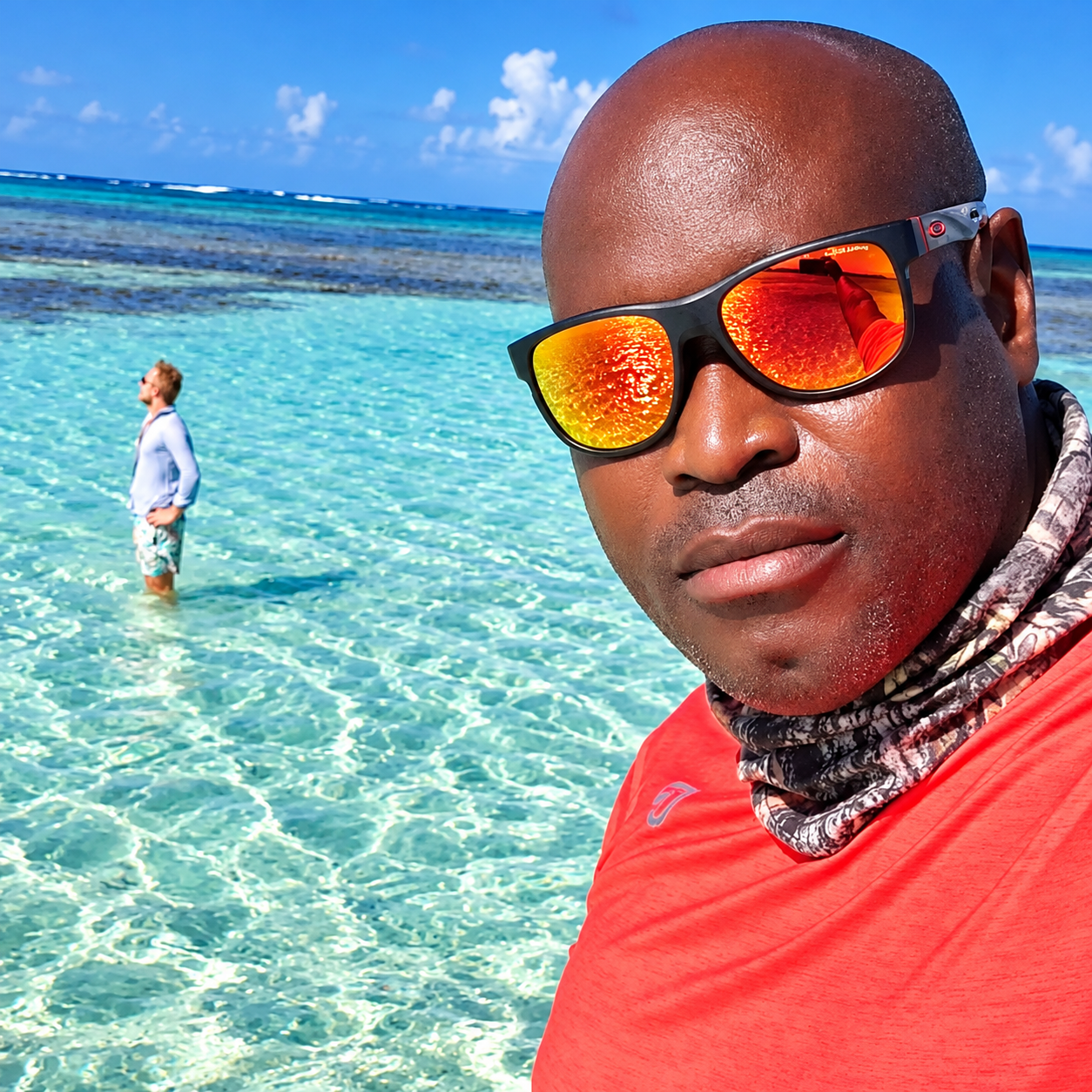 The waist-deep sandbar of the Nylon Pool, clear water running out to the reef line