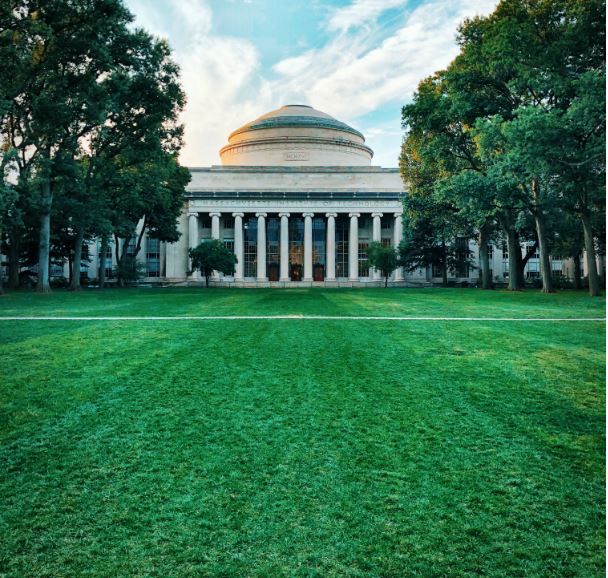 Green, level lawn in front of building