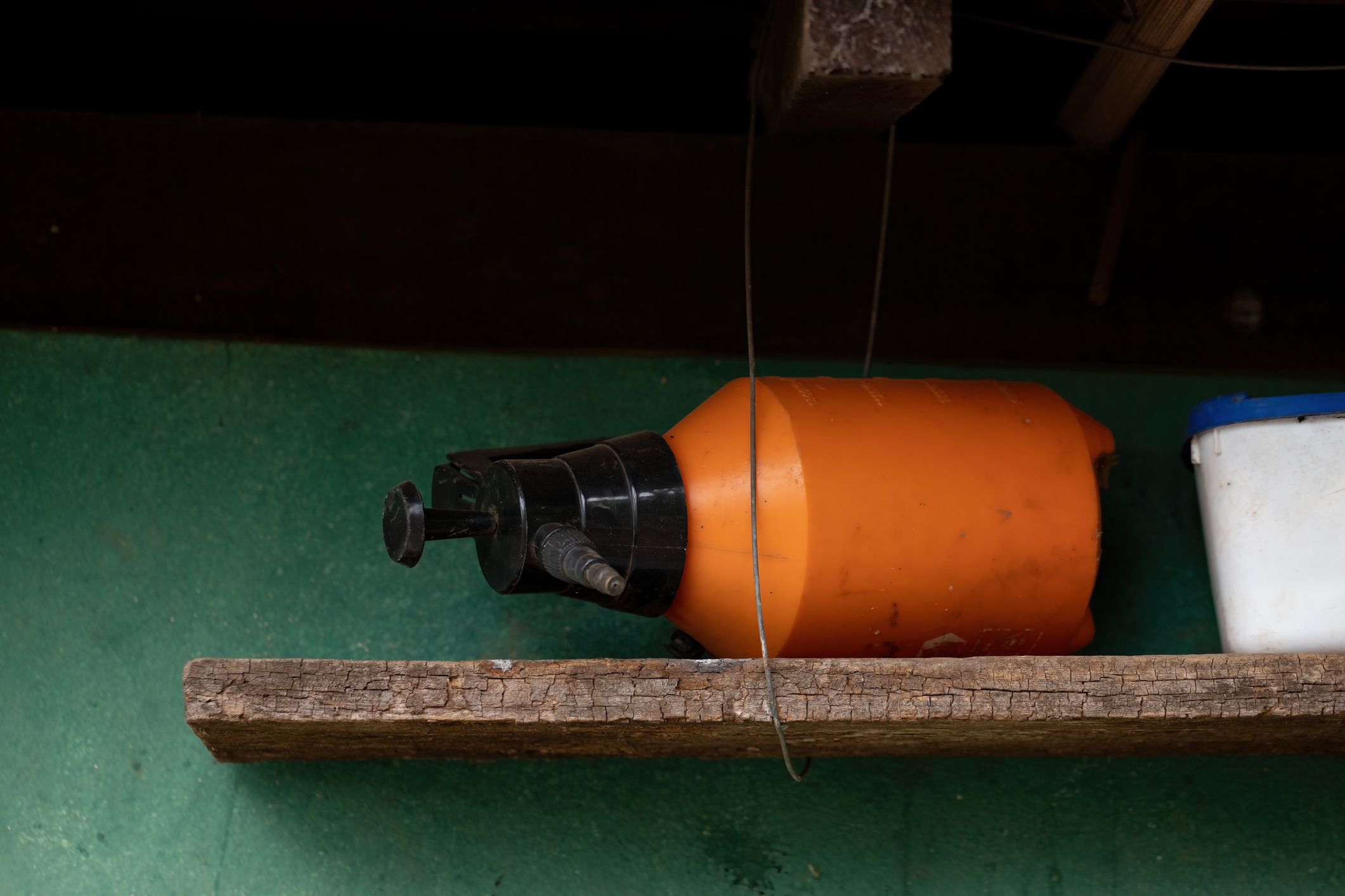 a pesticide bottle sideways on a shelf