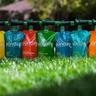 Sunday lawn fertilizer pouches in a line on a green lawn