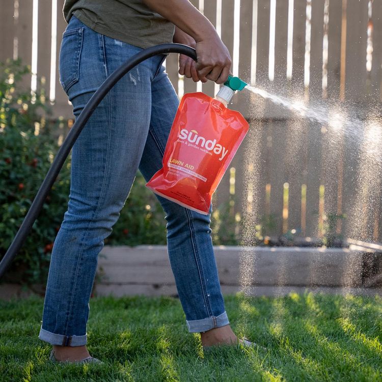 Lawn Aid Lawn Fertilizer spraying on lawn