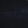A dark night sky filled with stars