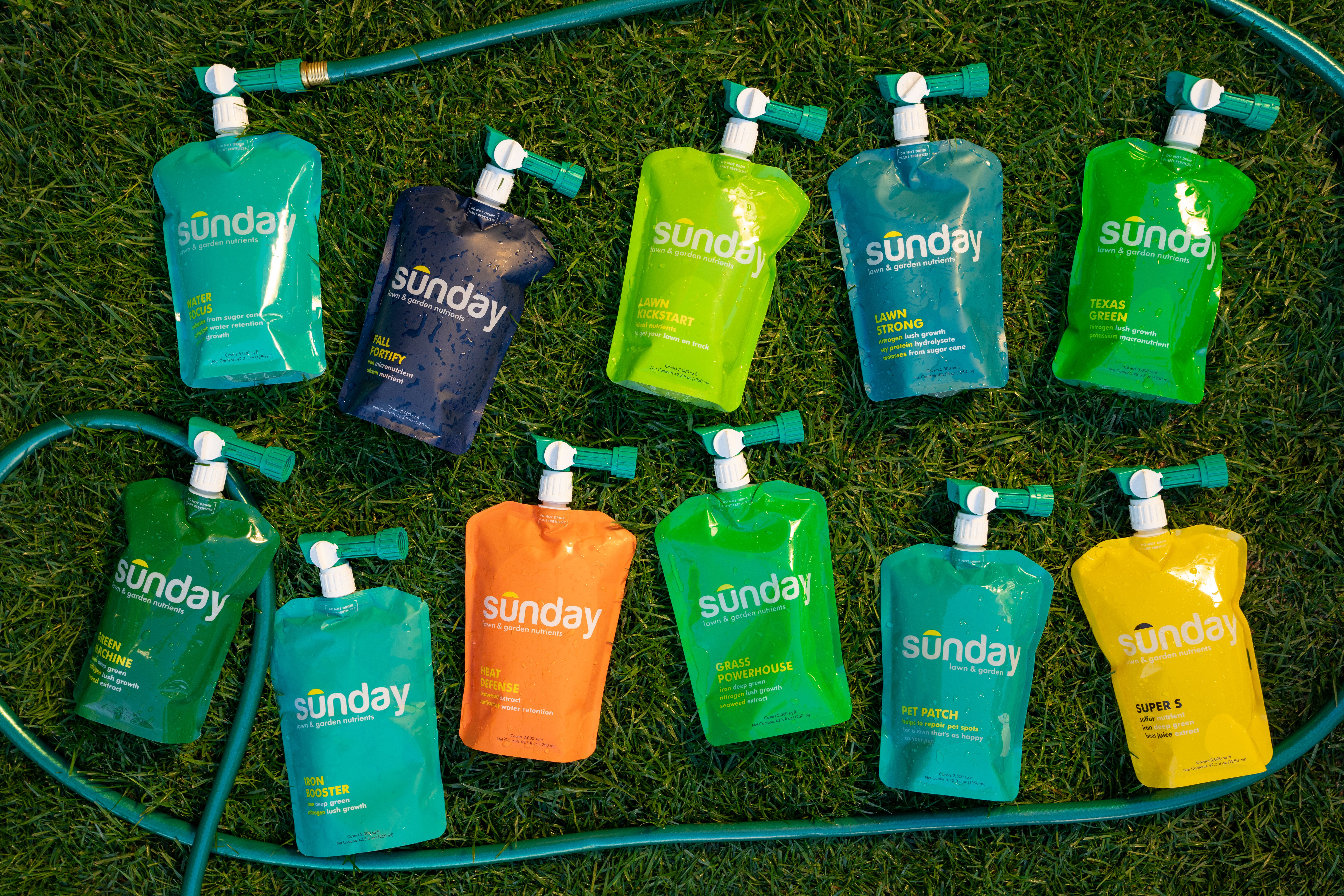 Sunday liquid lawn fertilizer pouches spread out on a lawn