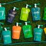 Sunday liquid lawn fertilizer pouches spread out on a lawn