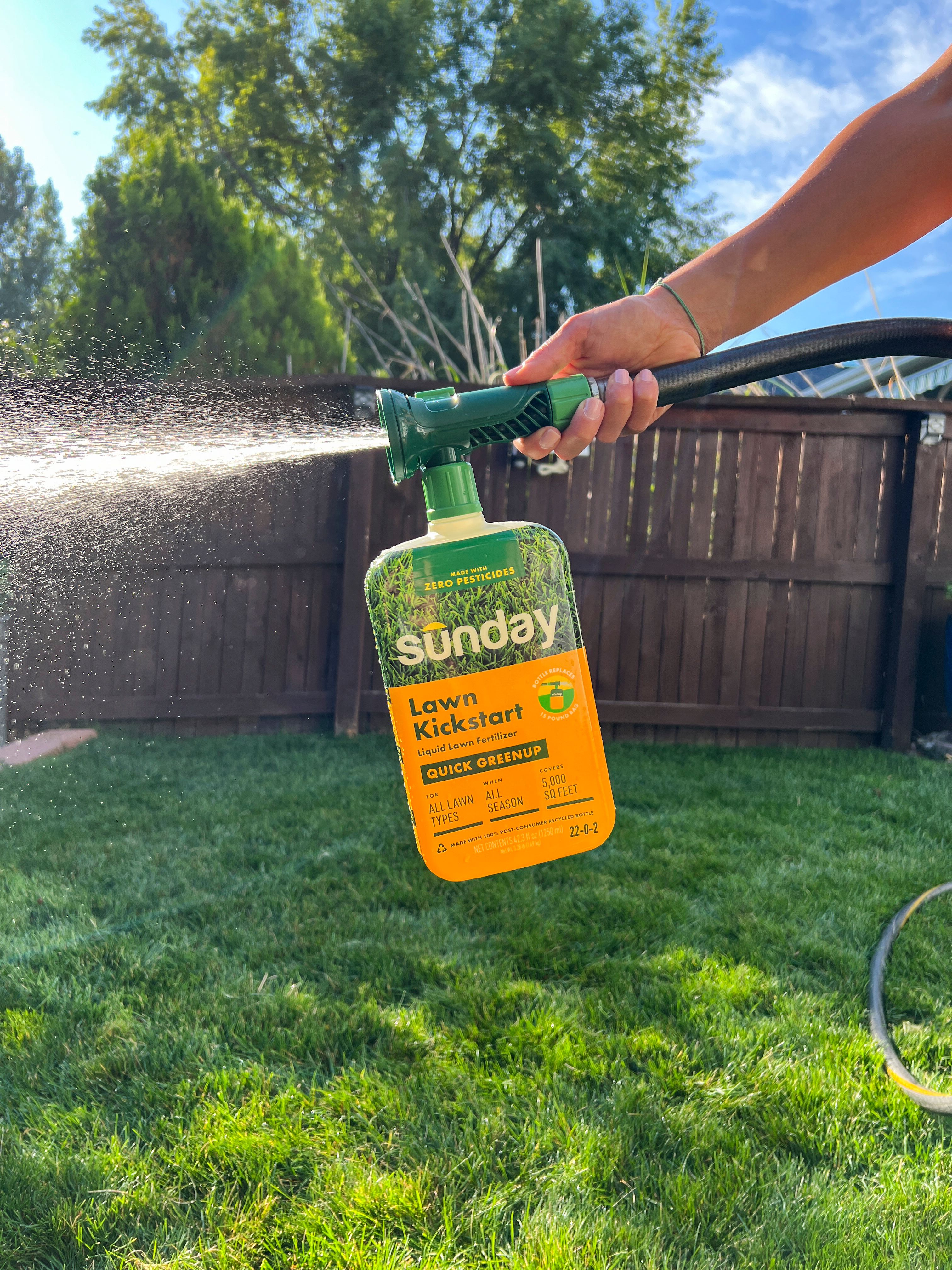 Sunday rigid fertilizer applied to a green lush lawn