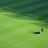 man mowing a large lawn
