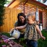 Mom and daughter caring for garden