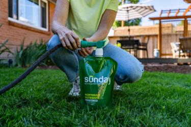 attaching hose end sprayer to liquid lawn fertilizer pouch