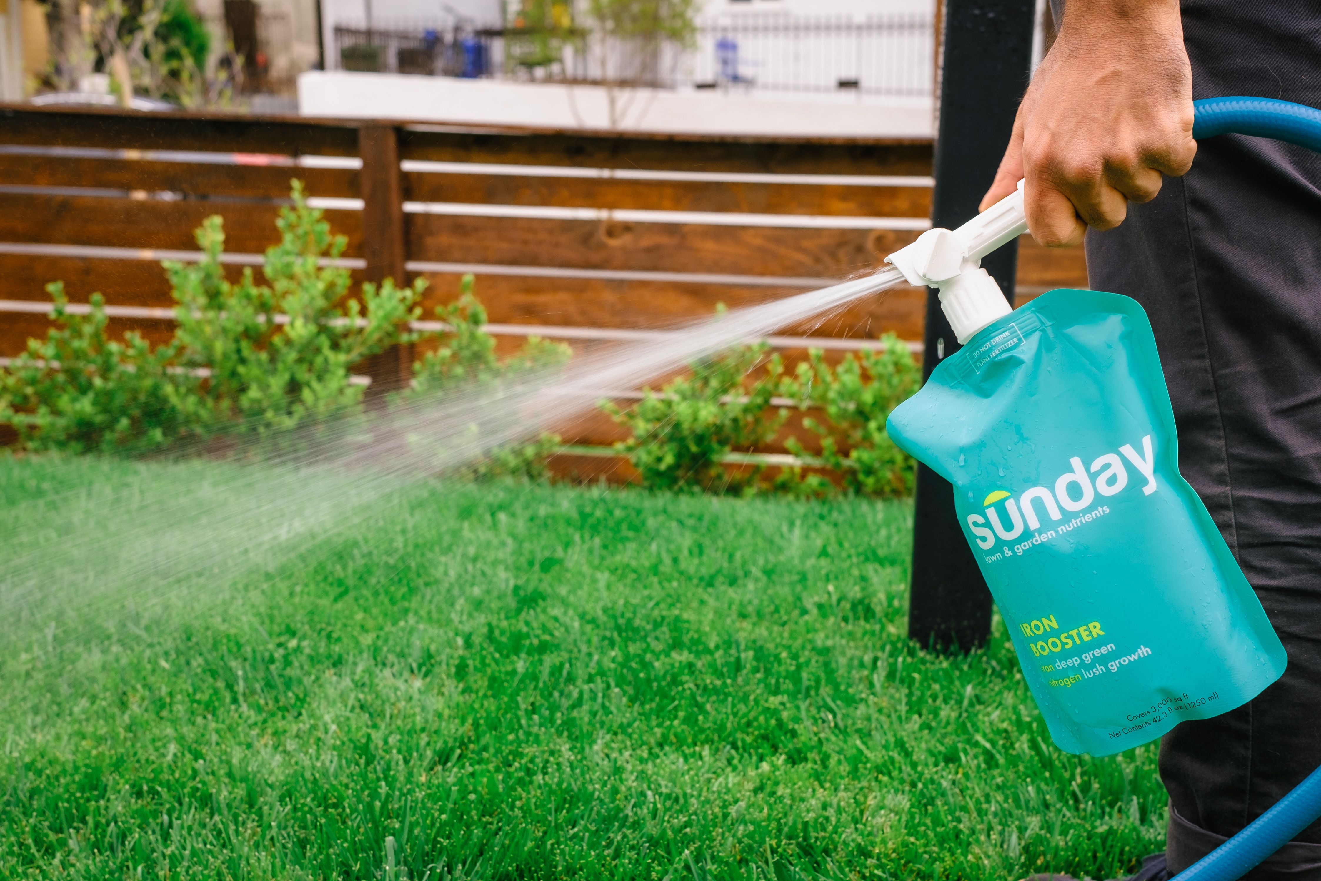 Spraying Sunday Lawn Nutrient Pouch