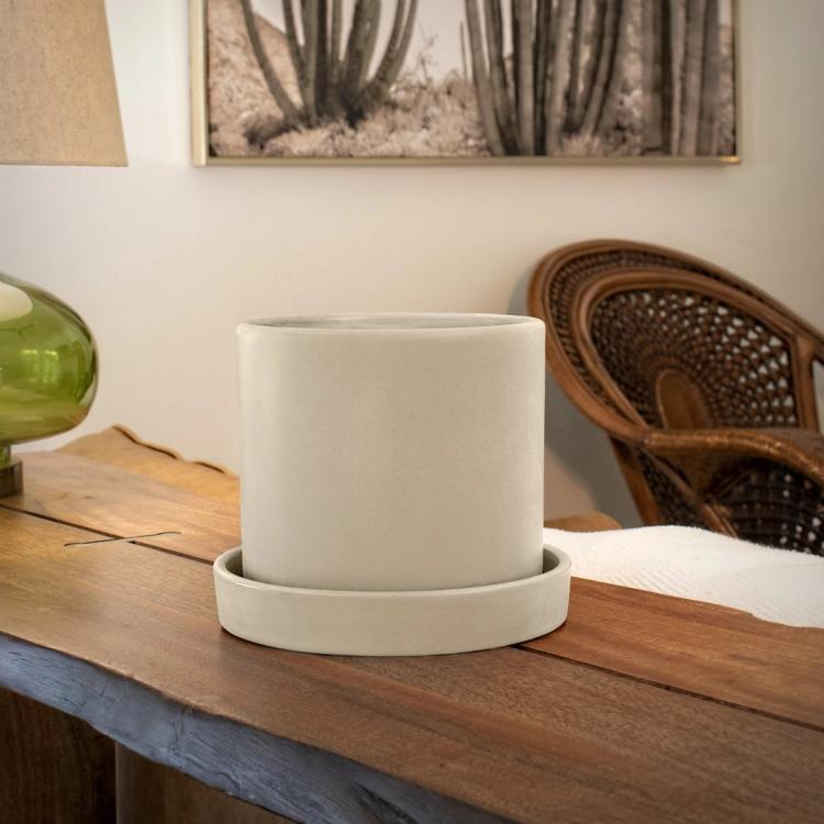 Lifestyle image of cream hyde pot on table