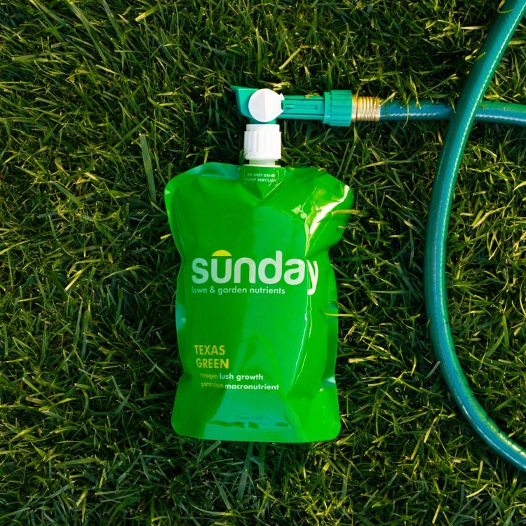 Texas Green pouch on grass with hose attached
