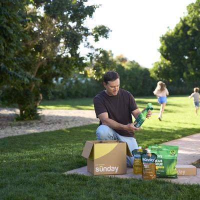 Man unboxing his Custom Yard Plan