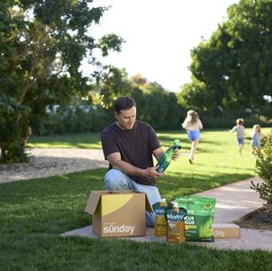 Man unboxing his Custom Yard Plan