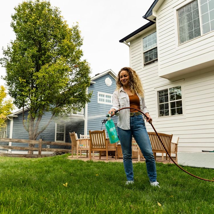 Applying water focus liquid lawn treatment