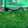 Lawn mower mowing grass