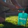 Connecting Sunday Pet Patch Lawn Treatment to hose on lawn