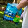 Man seeding lawn with Sunday Bermuda Time premium grass seed