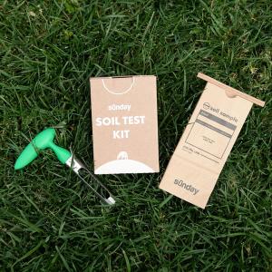 Sunday Soil Test Kit components on green grass.