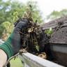 hand cleaning gutter