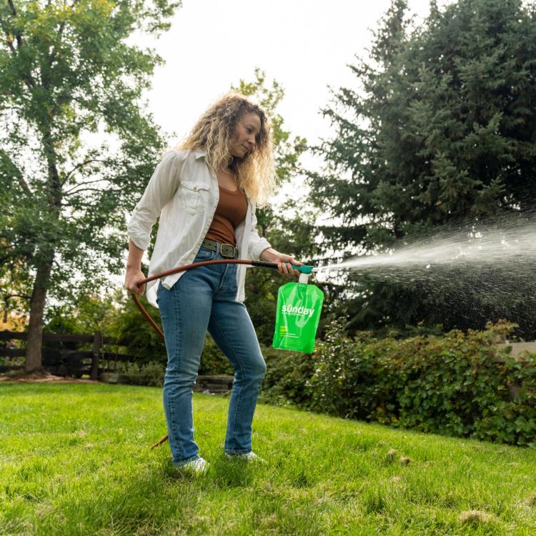 Woman spraying texas green