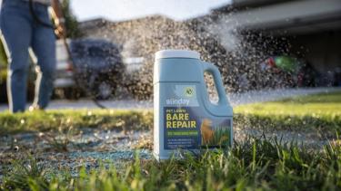 Applying Pet Lawn Bare Repair to pet spots in lawn