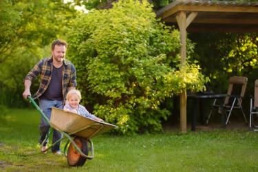 Dad and son with wheelbarrow