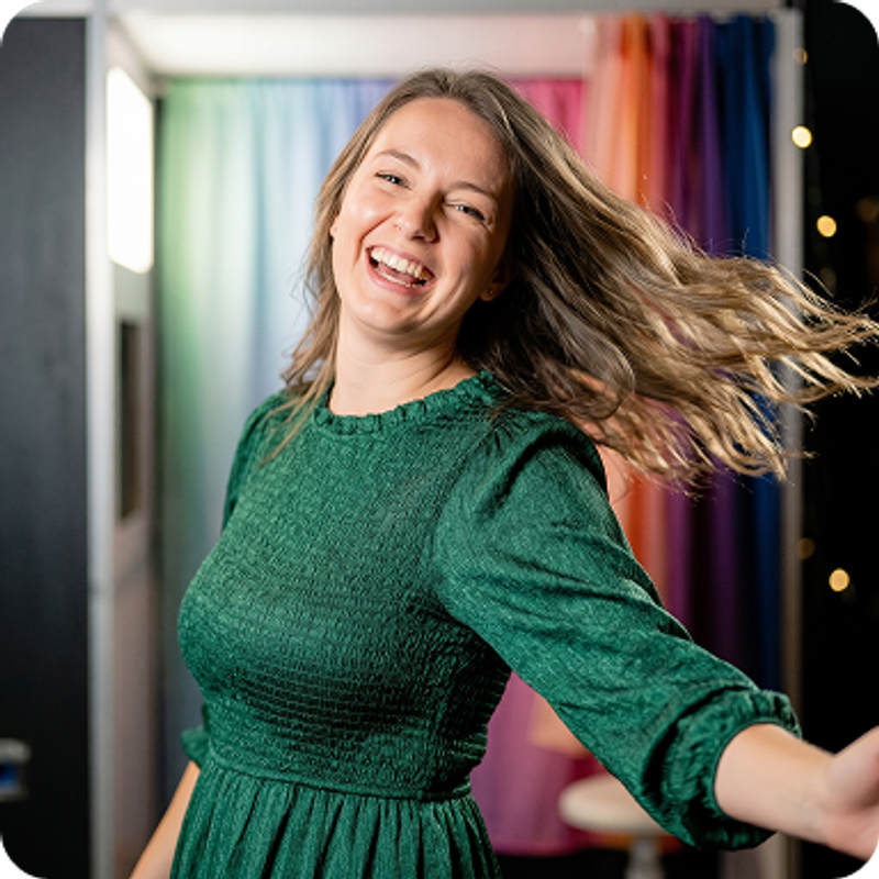 Hair blowing in the air - a woman is looking directly at the camera and taking a slow-mo capture with Booth.Events photo booth software.