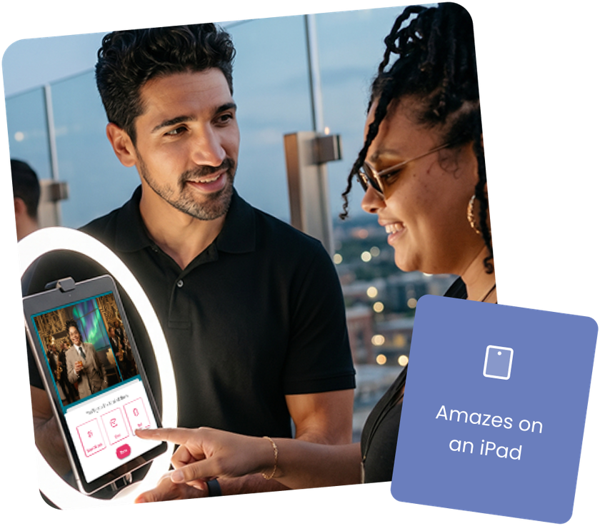 An image of a photo booth operator running an event with a guest at his booth.  He is looking confident and the guest is excited with the results from the Booth.Events photo booth.